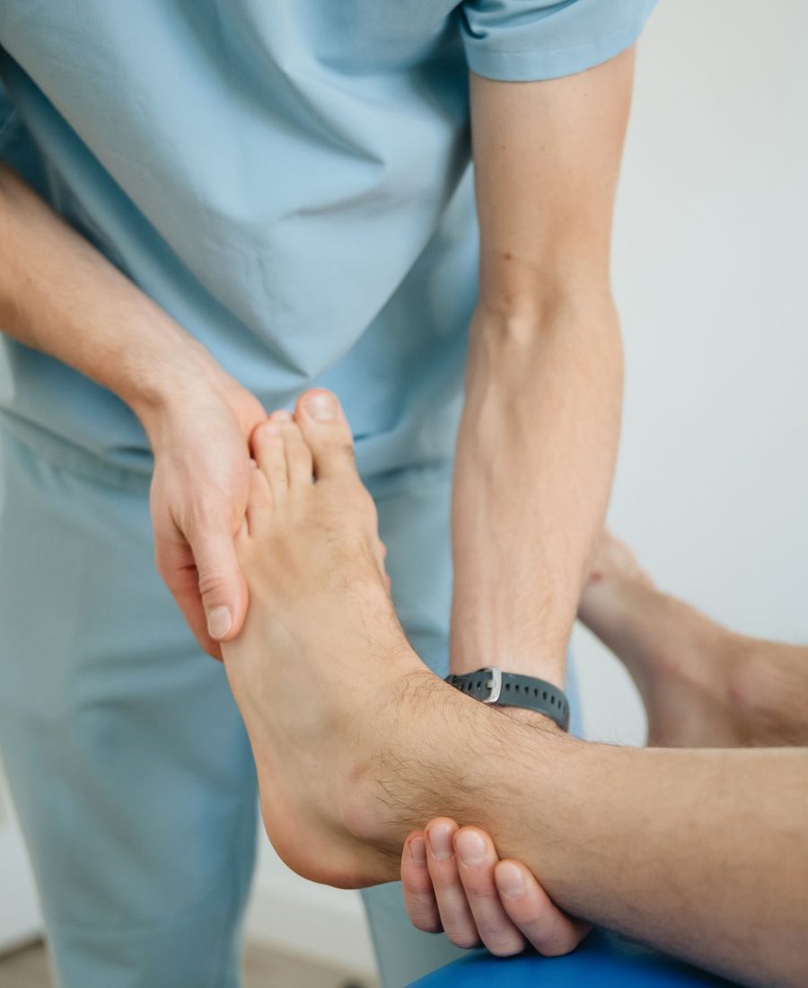 A clinician examining a patient's foot